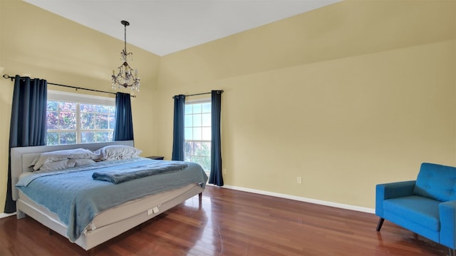 bedroom with dark hardwood / wood-style flooring