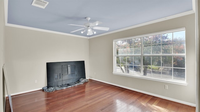 interior space featuring hardwood / wood-style flooring, ceiling fan, and crown molding