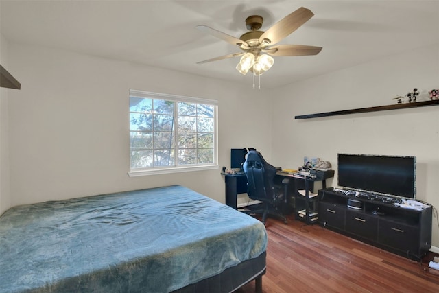 bedroom featuring dark hardwood / wood-style flooring and ceiling fan