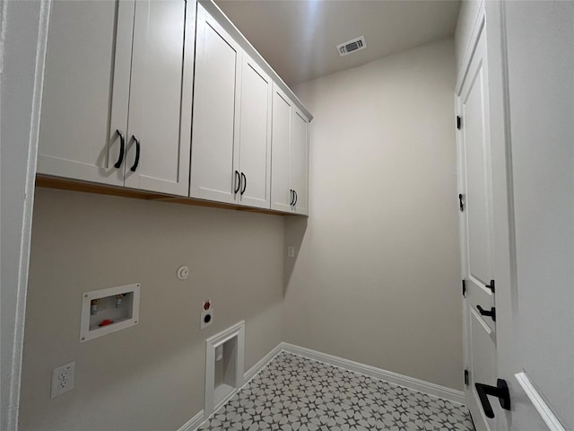 clothes washing area with gas dryer hookup, cabinets, washer hookup, and hookup for an electric dryer