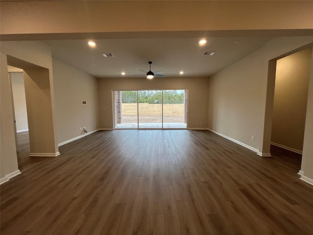 unfurnished room featuring ceiling fan and dark hardwood / wood-style flooring