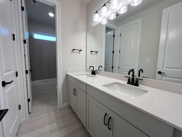 bathroom featuring vanity and washtub / shower combination