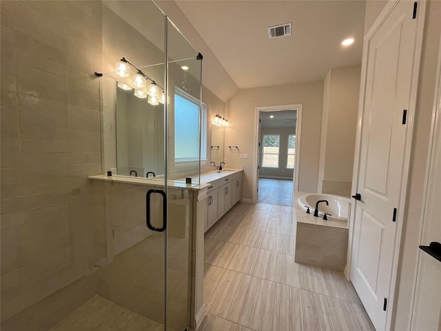 bathroom featuring vanity and shower with separate bathtub