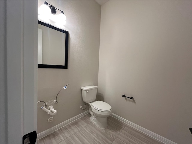 bathroom featuring toilet