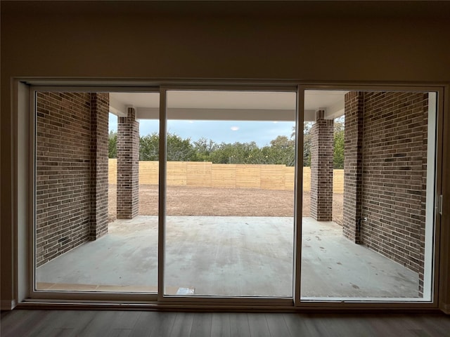 doorway to outside with hardwood / wood-style flooring