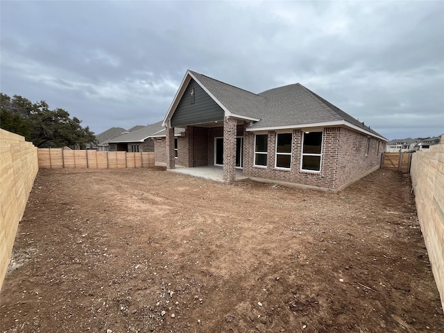 back of property featuring a patio