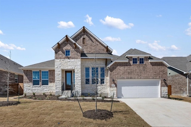 view of front of home featuring an attached garage, brick siding, concrete driveway, stone siding, and roof with shingles