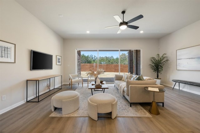 living room featuring baseboards and wood finished floors