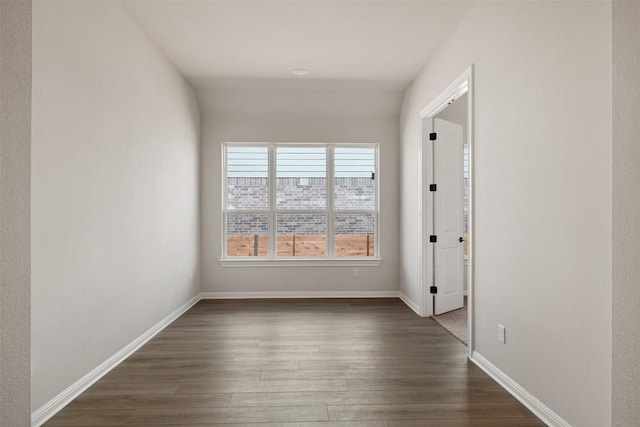 interior space with dark wood-style floors and baseboards