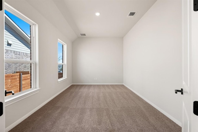 carpeted spare room with recessed lighting, visible vents, and baseboards