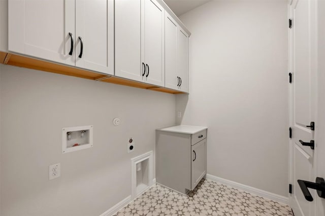 laundry area with cabinet space, baseboards, hookup for a washing machine, hookup for an electric dryer, and light floors