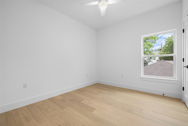 spare room with ceiling fan and light hardwood / wood-style flooring