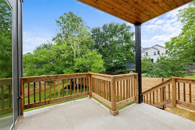 wooden deck featuring a yard