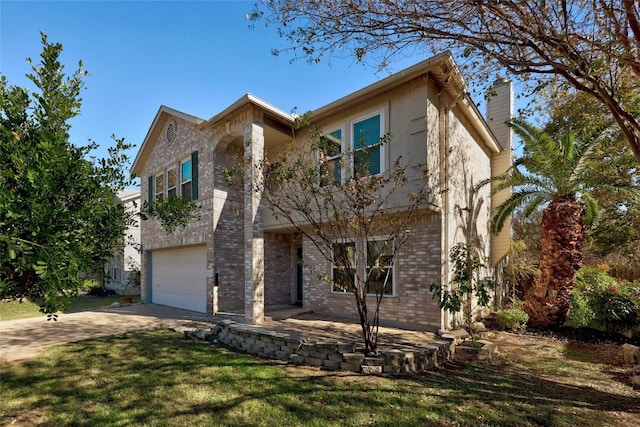 view of front of property with a garage and a front lawn