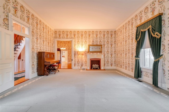 unfurnished living room featuring carpet flooring and crown molding