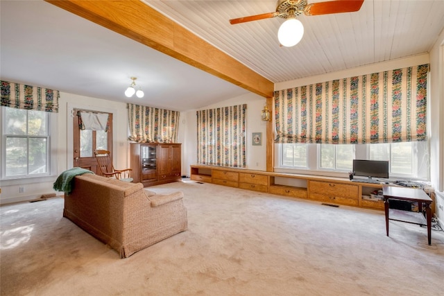 living room with carpet flooring, lofted ceiling with beams, ceiling fan, and a wealth of natural light