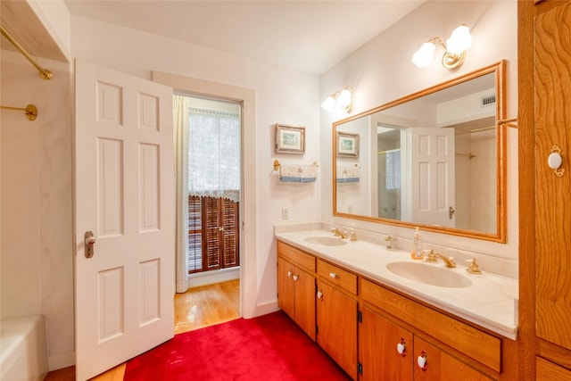 bathroom featuring vanity and wood-type flooring