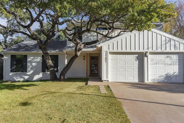 single story home featuring a front lawn and a garage