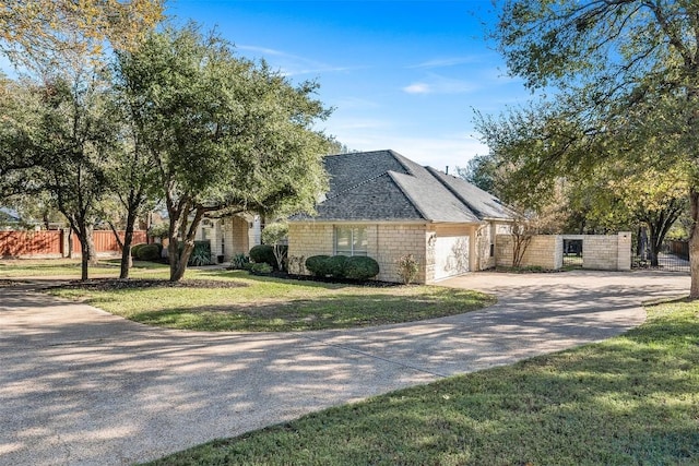 view of front of home with a garage and a front yard