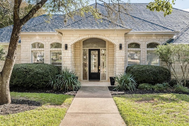 entrance to property with a yard