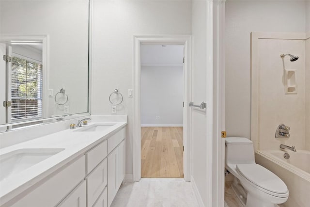 full bathroom with washtub / shower combination, wood-type flooring, vanity, and toilet