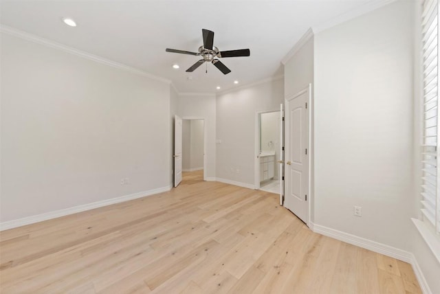 unfurnished bedroom featuring ceiling fan, ensuite bath, crown molding, and light hardwood / wood-style flooring