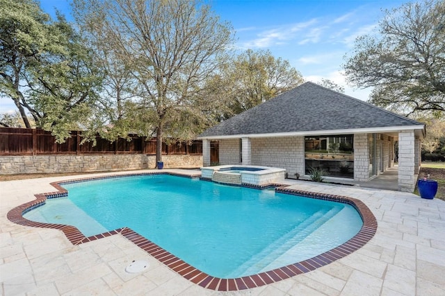 view of pool featuring an in ground hot tub and a patio