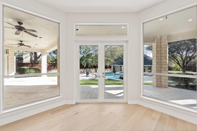 entryway with light hardwood / wood-style flooring and french doors