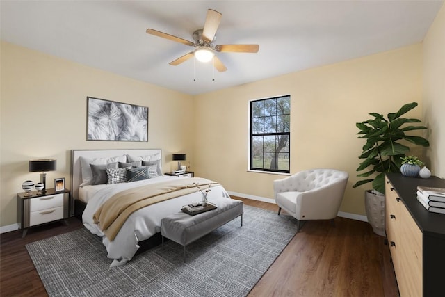 bedroom with ceiling fan and dark hardwood / wood-style flooring