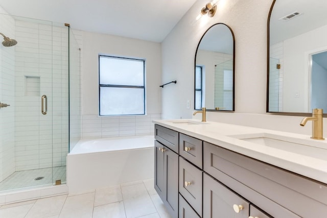 bathroom featuring vanity, tile patterned floors, and plus walk in shower