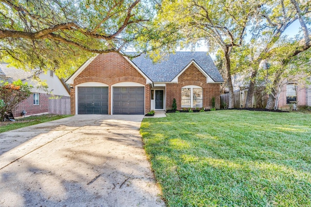 view of front of home featuring a front lawn and a garage