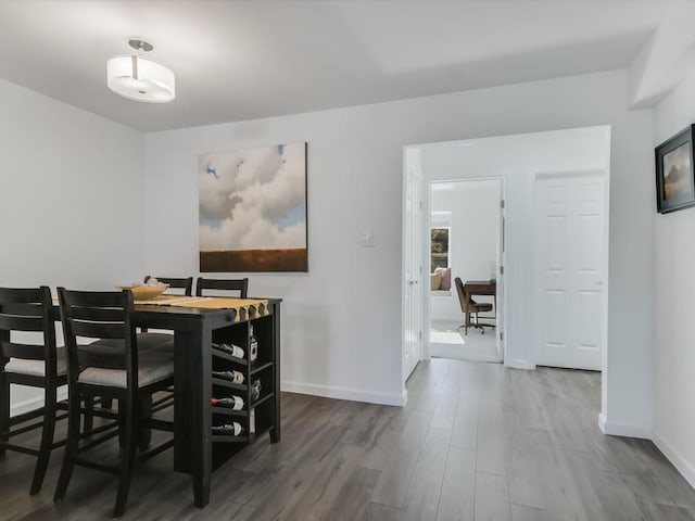 dining room with hardwood / wood-style floors