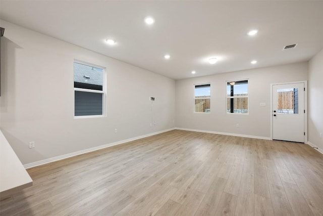 727 Palo Brea Loop, Hutto, TX 78634 - spare room featuring light wood finished floors, baseboards, and recessed lighting