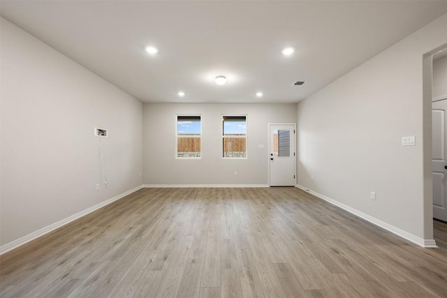727 Palo Brea Loop, Hutto, TX 78634 - unfurnished room with light wood-type flooring, baseboards, and recessed lighting