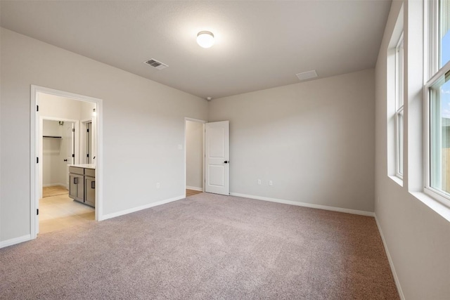 727 Palo Brea Loop, Hutto, TX 78634 - unfurnished bedroom featuring light colored carpet and baseboards