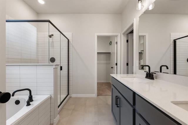 727 Palo Brea Loop, Hutto, TX 78634 - full bath with a shower stall, a garden tub, double vanity, and tile patterned flooring