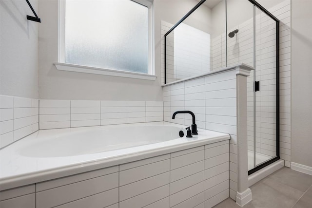 727 Palo Brea Loop, Hutto, TX 78634 - full bathroom with a stall shower, a garden tub, and tile patterned floors
