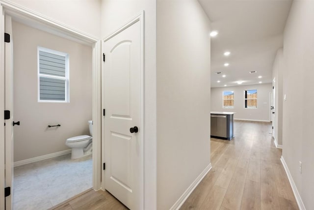 727 Palo Brea Loop, Hutto, TX 78634 - hall with light wood-type flooring, recessed lighting, and baseboards
