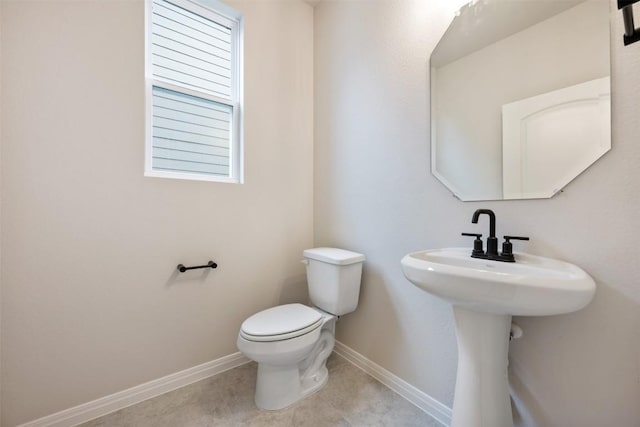727 Palo Brea Loop, Hutto, TX 78634 - bathroom featuring toilet, baseboards, and tile patterned floors