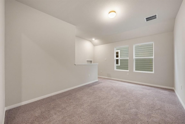 727 Palo Brea Loop, Hutto, TX 78634 - carpeted spare room with baseboards and vaulted ceiling