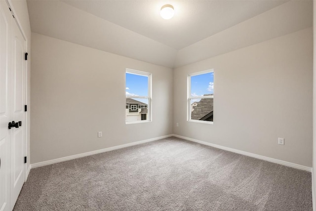 727 Palo Brea Loop, Hutto, TX 78634 - unfurnished room featuring carpet flooring, baseboards, and vaulted ceiling