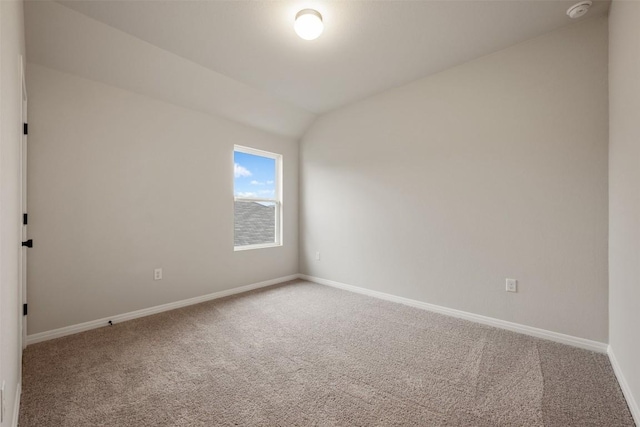 727 Palo Brea Loop, Hutto, TX 78634 - carpeted spare room with baseboards, a smoke detector, and lofted ceiling
