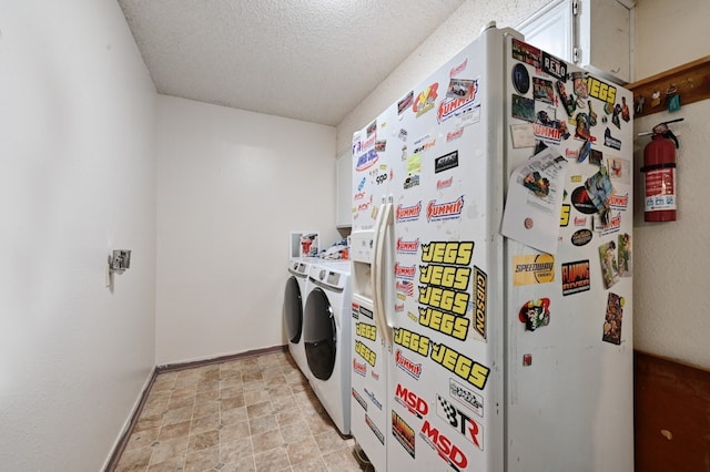 laundry area featuring a textured ceiling and independent washer and dryer