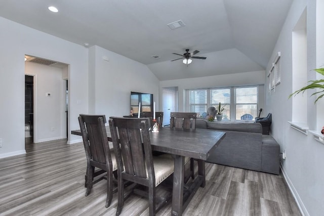 dining space with lofted ceiling, hardwood / wood-style floors, and ceiling fan