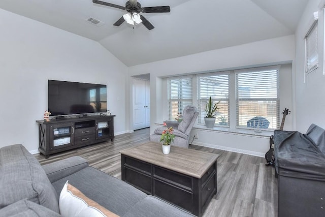 living room with lofted ceiling, wood-type flooring, and ceiling fan