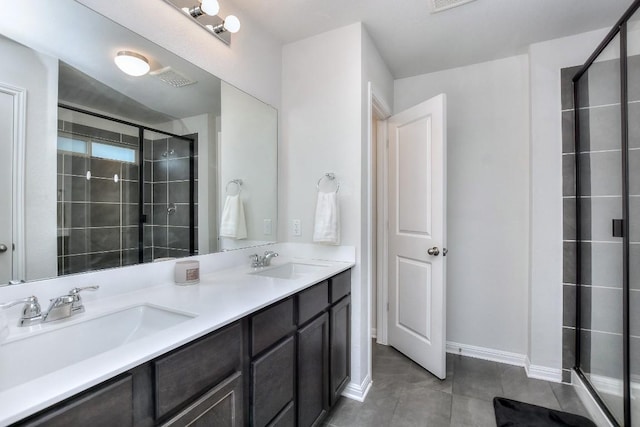 bathroom featuring vanity, an enclosed shower, and tile patterned flooring