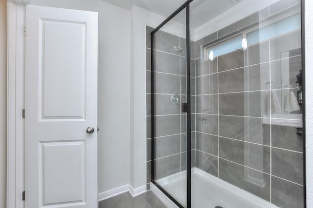 bathroom with a shower with shower door