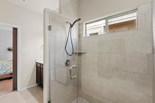 bathroom with vanity, tile patterned floors, and a shower with door