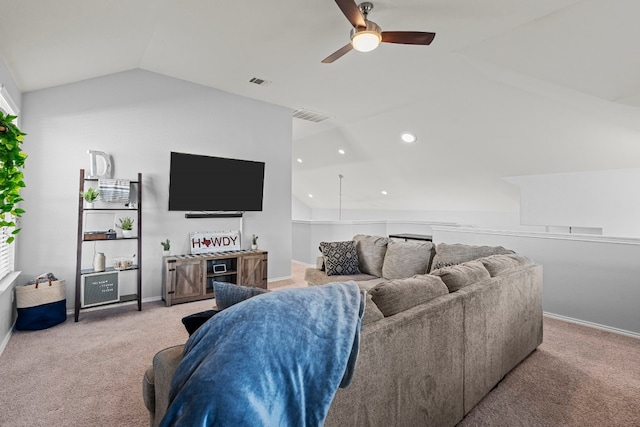 carpeted living room featuring vaulted ceiling and ceiling fan