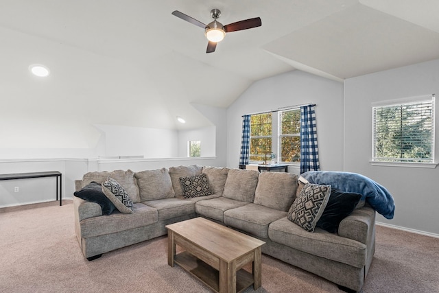 living room featuring carpet flooring, vaulted ceiling, plenty of natural light, and ceiling fan